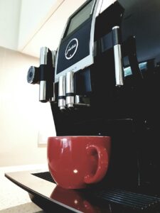 Coffee machine with red mug